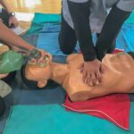 CPR training on a manikin with chest compressions and bag-valve-mask ventilation