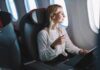 Painful Ear Infections: When Earbuds Turn Toxic Passenger with headphones seated by airplane window
