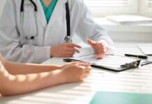 Always Tired? Doctors Blame One Overlooked Test Doctor discusses medical notes with patient at a desk